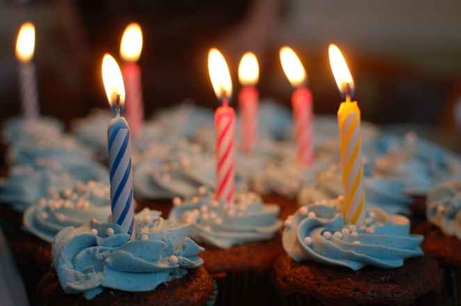 lighted candles on cupcakes